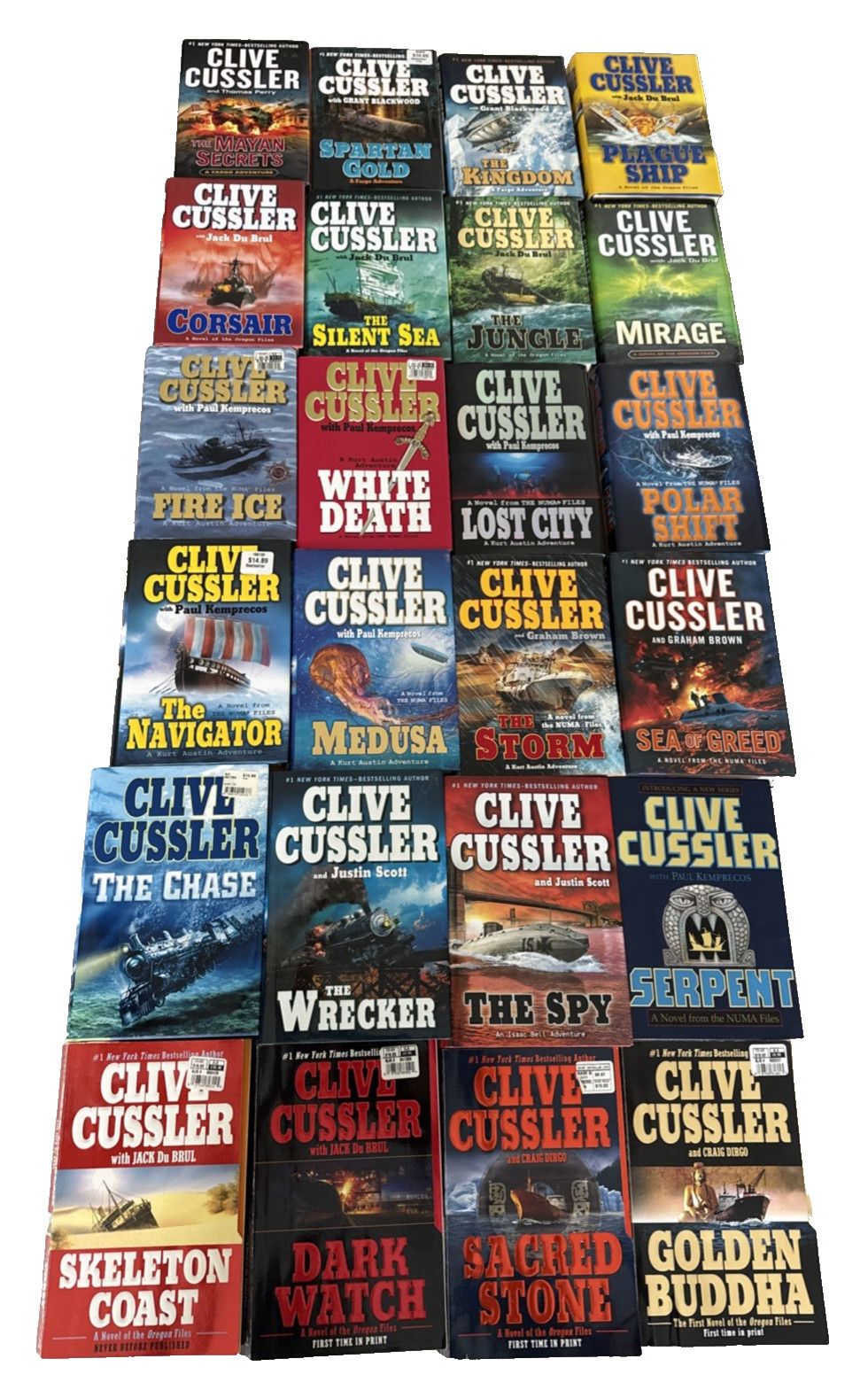 Clive Cussler Assorted Series – Lot 24 (19) Hard Cover and (5) Paperback