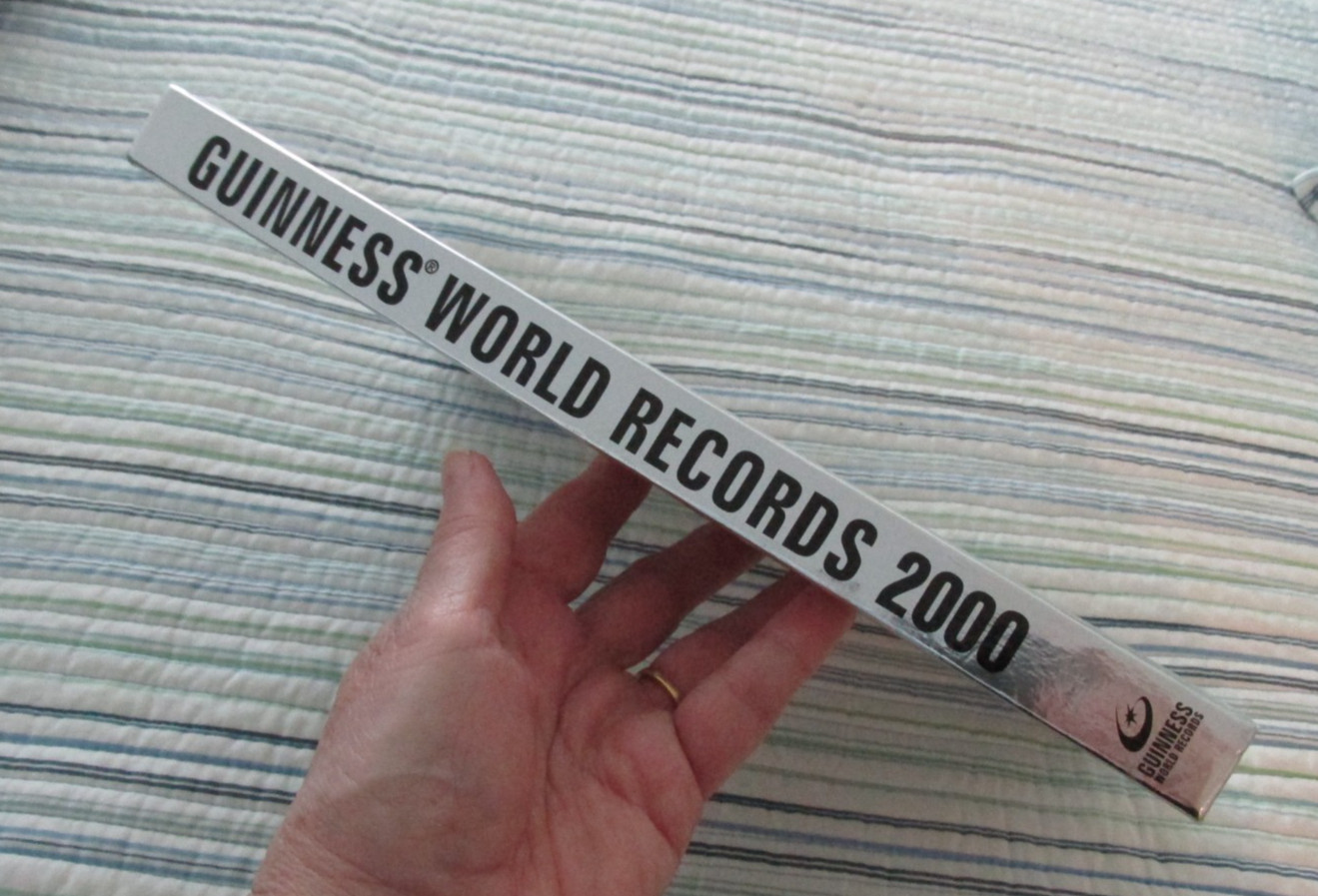 Vintage Guinness Book Of World Records 2000 Millennium Edition Silver Hard Cover