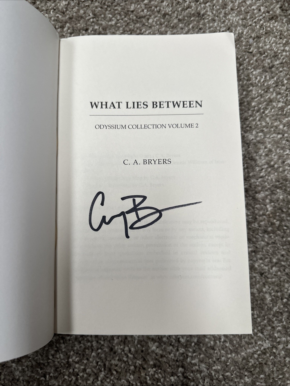 SIGNED COPY – What Lies Between: Odyssium Collection Volume 2
